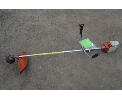 A STIHL FS 44 PERTOL STRIMMER, with manual (pulls freely  and starts)