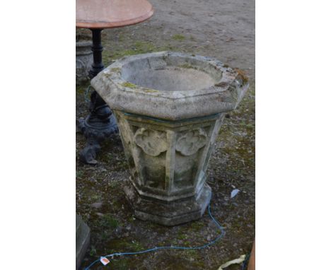 A WEATHERED COMPOSTITE ECCLESIASTICAL GARDEN PLANTER, of a tapered octagonal form and with quatrefoils, diameter 58cm x 59cm
