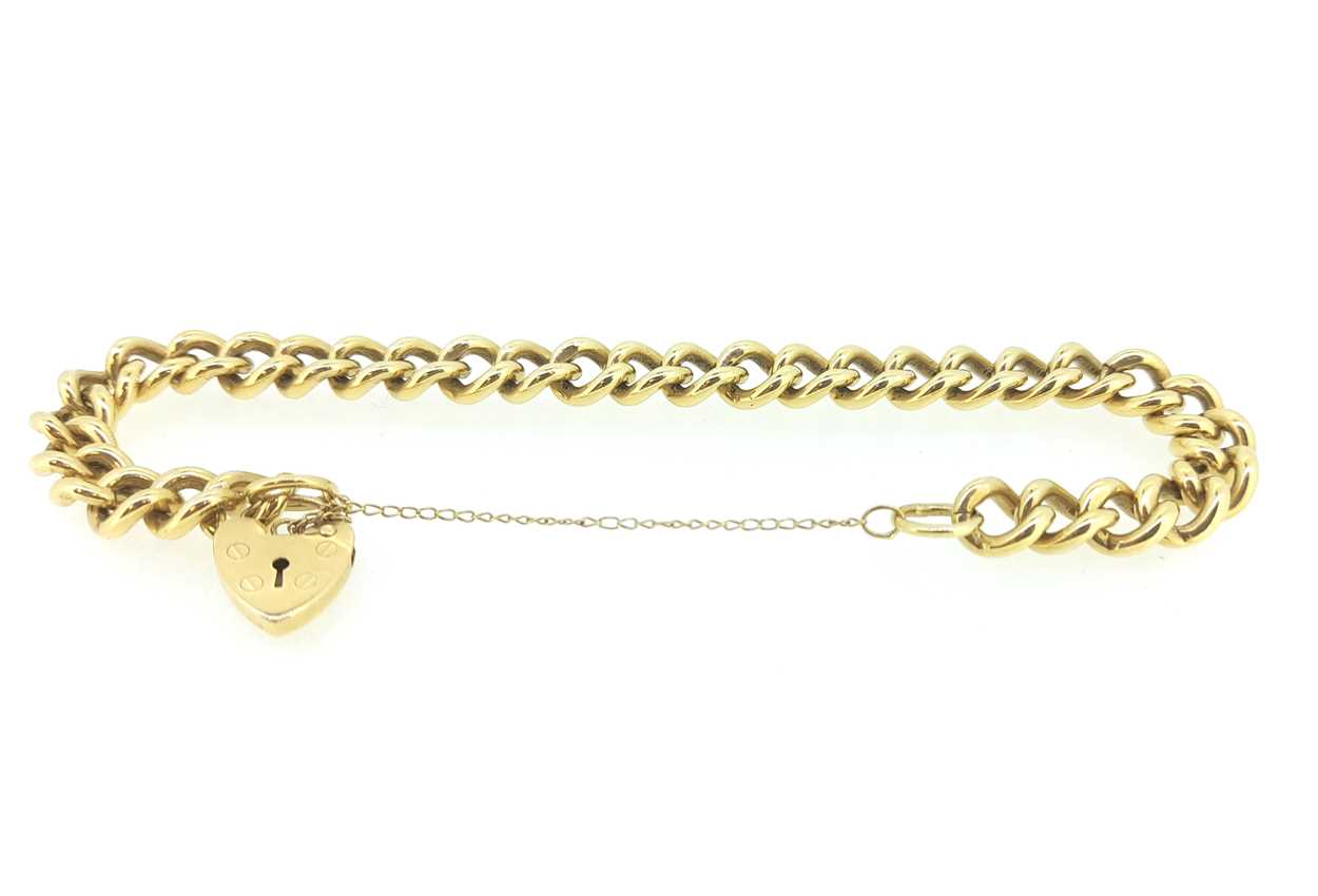 A 9ct gold charm bracelet with padlock, in - Cheffins Fine Art