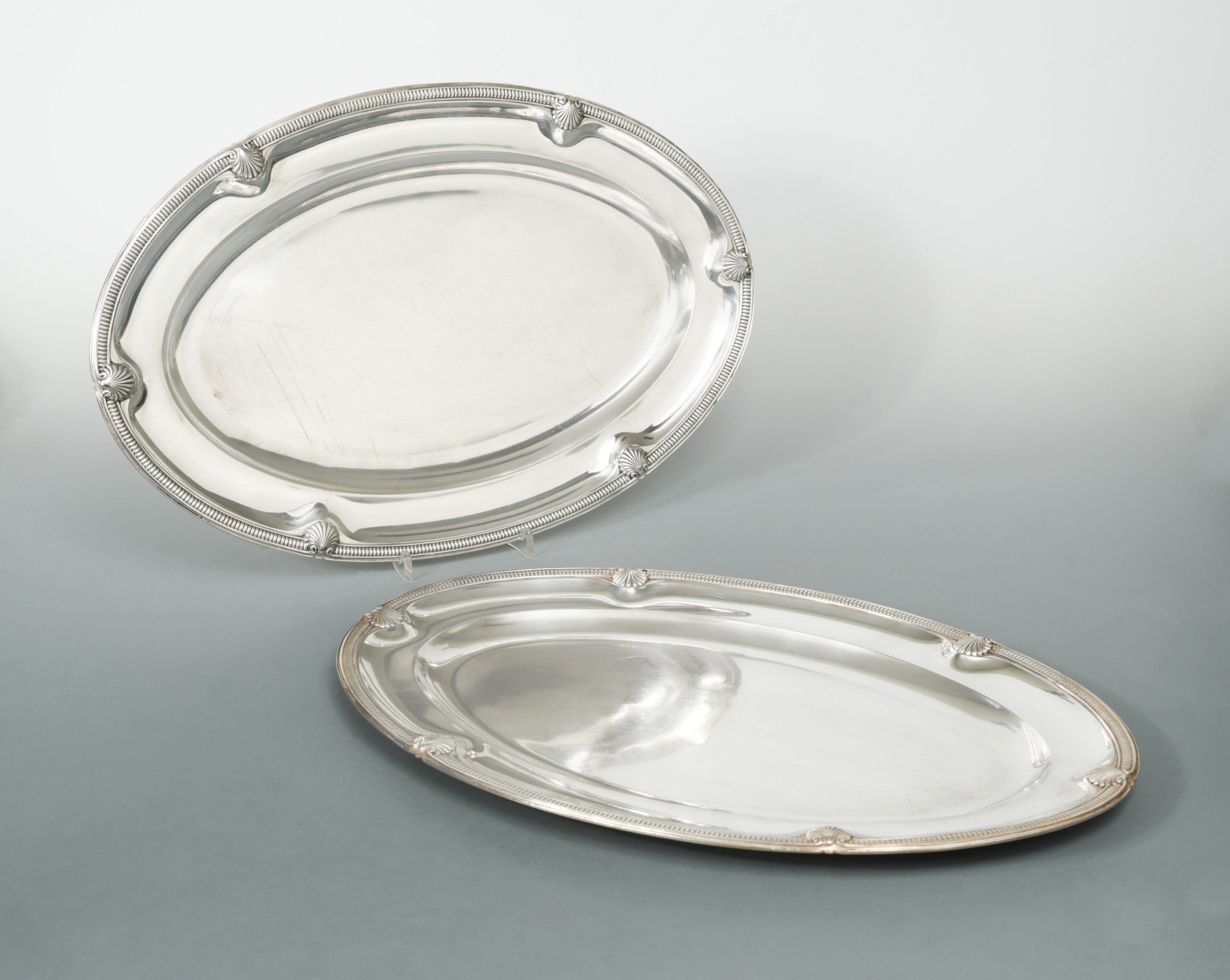 A pair of 20th century French metalwares silver platters, in Cheffins