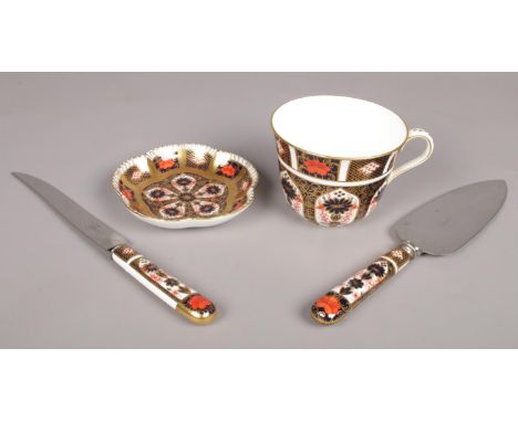 Four pieces of Royal Crown Derby Imari pattern ceramics. Including teacup, trinket dish, knife, etc.  Cup and dish both good 