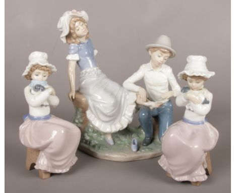 Three Nao figures. Including figure group of young boy and girl, two figures of seat girl with dog.  Heads lose of girls with