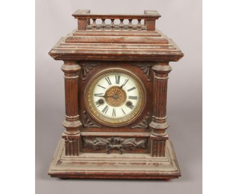 A mahogany cased Wurttemberg 8 day mantel clock with key.  