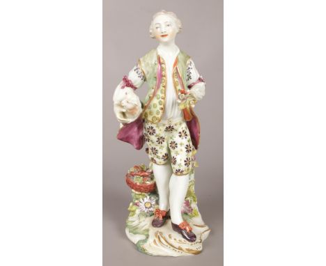 An 18th century Derby porcelain figure of a gentleman with a lamb and flower basket. 21.5cm.  Restoration to frock coat and m