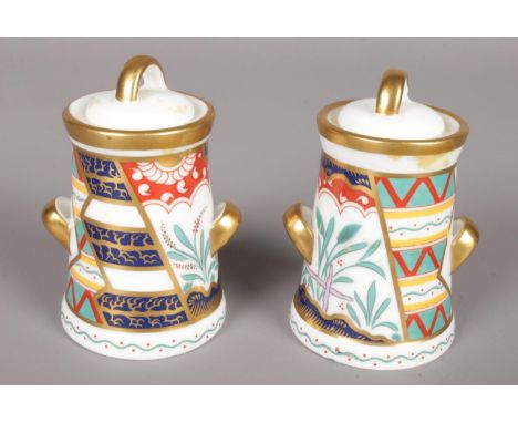 A pair of small Royal Crown Derby twin handled lidded pots. (8cm high)  Chip to base of one pot. First quality.