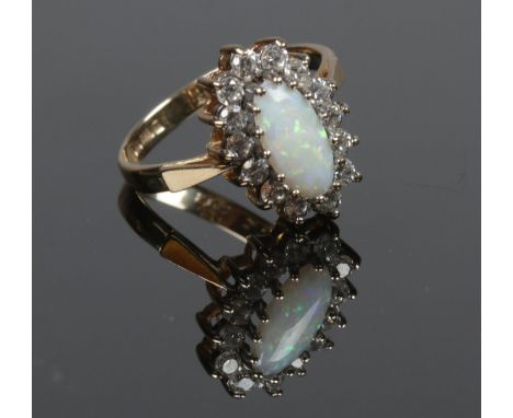 A ladies 9ct gold Opal and cubic zirconia cluster dress ring. Size L 1/2. Total weight: 2.60g.  