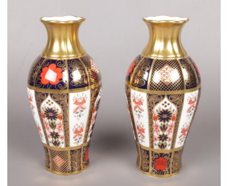 A pair of Royal Crown Derby baluster shaped vases in the Old Imari pattern. (19cm high)  Good condition. First quality.