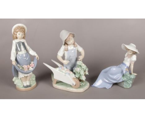 Three Nao ceramic figures. Including Girl with wheelbarrow, girl and bird example, etc.  