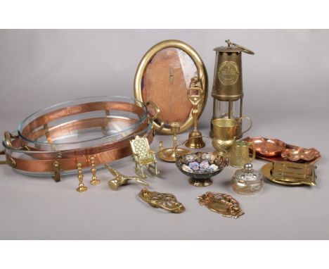 A collection of metal ware's. A Protector Miner's Lamp Type 6, Swedish oven to tableware servers, brass candlestick etc  