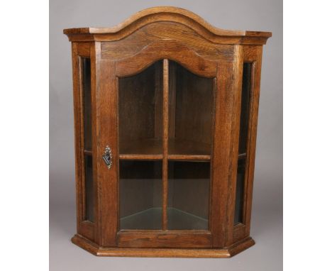 A hanging oak lockable corner display unit with single shelf.  