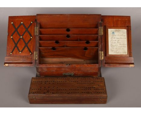 An early 20th century oak desk tidy along with a mahogany storage bow with cribbage board top.  