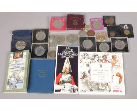 An assortment of commemorative coins, to include anniversary of the D-Day landings 50p piece, Britain's first decimal coins a