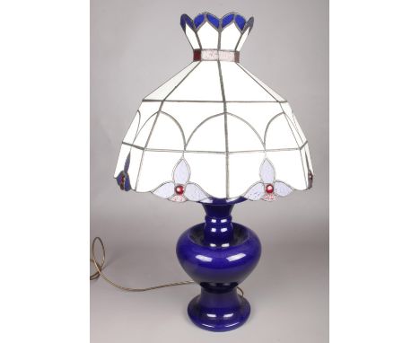 A blue ground baluster shaped ceramic table lamp with large tiffany style lamp shade. (70cm high)  