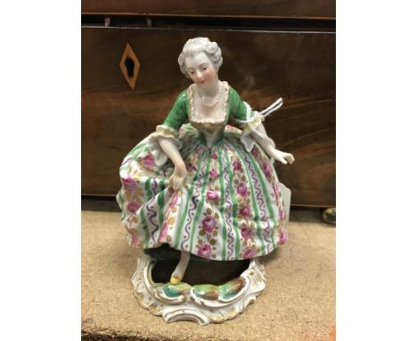 A Sèvres porcelain figure of a risqué lady in period dress stepping over a puddle, 13 cm high CONDITION REPORTS Visually the 