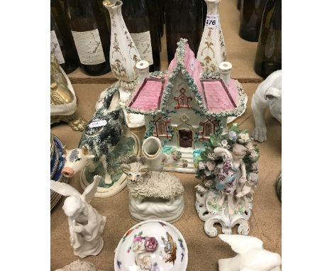 A collection of Continental and English china to include a Staffordshire cottage, pair of Victorian porcelain and gilt decora