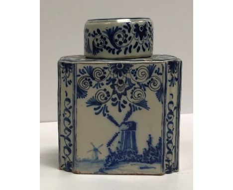 A 19th Century Delft ware tea caddy set with windmills, bearing "VR" mark to base, 11.5 cm high including lid