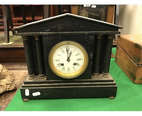 A black slate mantel clock, the white dial set with Roman numerals, 31 cm long x 26.5 cm high, together with an early 20th Ce