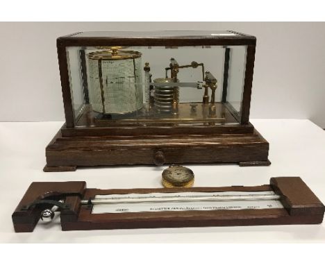 An oak cased barograph by Negretti and Zambra, together with a mahogany cased horizonal barometer thermometer by Negretti and