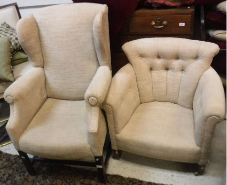 A modern wing back scroll armchair, raised on square legs, together with a modern upholstered button back tub chair, raised o