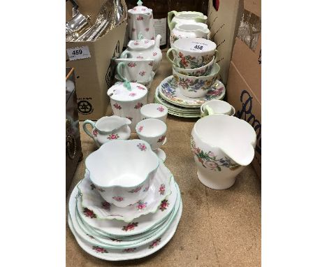 A Shelley "Rosebud" No. 13426 part tea service comprising small teapot, 12 cm high, hot water jug, two teacups and saucers, l