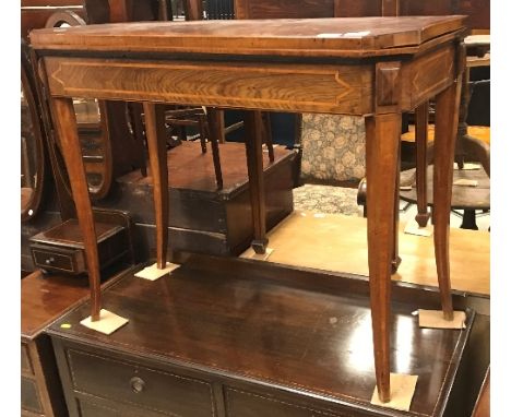 An early 19th Century rosewood and cross-banded fold-over card table on square tapered splayed supports, 91.5 cm wide x 45 cm