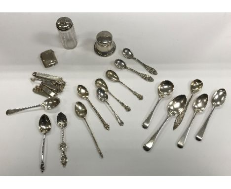 A collection of various small silver wares to include thirteen various spoons, engraved vesta case, two name tag chain bracel