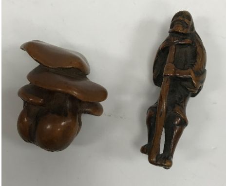 A 19th Century Japanese Meiji period carved boxwood netsuke as a group of five mushrooms, signed to base, 3.5 cm high, togeth
