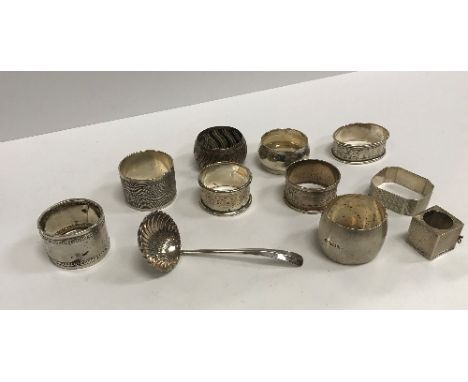 A collection of eight various silver napkin rings, a silver snooker chalk holder (incomplete), a plated WMF shell bowled ladl