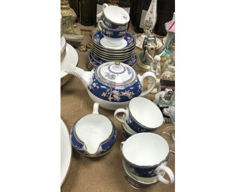 A Wedgwood "Blue Siam" six place tea service comprising teacups and saucers, side plates, teapot, milk jug and additional sma