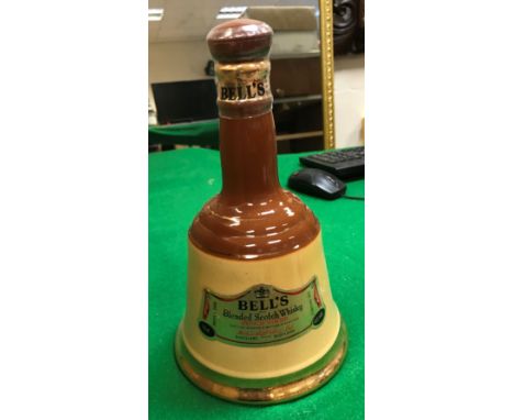 A Bells Scotch Whisky bell-shaped commemorative porcelain decanter to celebrate The Birth of Prince William of Wales 21st Jun