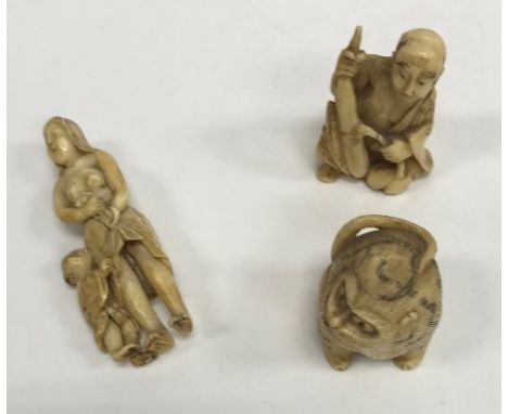 A 19th Century Japanese Meiji period carved ivory netsuke as a mother and child, signed with two character mark on plaque ver