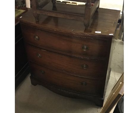 An early to mid 20th Century mahogany bow fronted chest of three long drawers in the Georgian manner, raised on bracket feet,