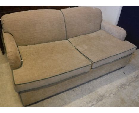 A modern fawn upholstered and green tubelined two seat sofa bed on square tapered mahogany legs 180 cm wide x 98 cm deep x 81