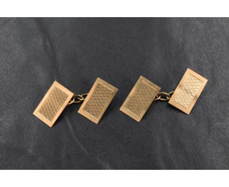 A pair of 9ct gold cufflinks, having rectangular panels with engine turned decoration and chain links, 3.1g