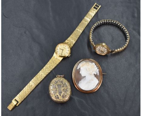 A 9ct gold wrist watch by Everite having baton numeral dial in plain gold case, missing glass and plated stretch strap damage
