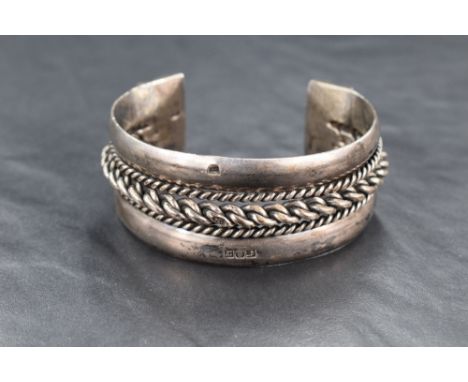 An Egyptian silver cuff bangle having twist decoration and moulded terminals, bearing Egyptian hallmarks, approx 75.5g