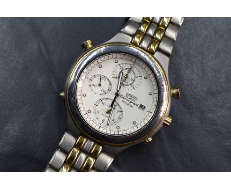 A Seiko quartz chronograph titanium wristwatch, the white dial with dot five minute markers, date aperture and three subsidia