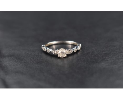 A 9ct white gold diamond set wedding band and matching engagement ring of delicate shaped form, both size H &amp; approx 2.6g