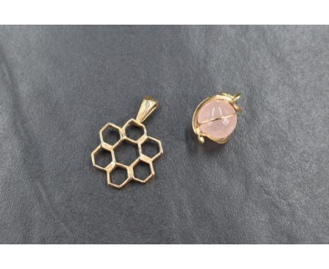 A 9ct gold honey comb motif pendant, sold along with a rose quartz orb pendant, mounted in high carat gold, 3.6g gross