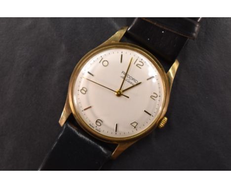 A gent's 9ct gold Record Deluxe manual wrist watch having Arabic numeral and baton dial to silvered face in a plain case bear