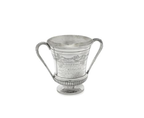 A George III silver two-handled cupPaul Storr, London 1816 Vase form with a short part fluted bellied lower body, on a spread