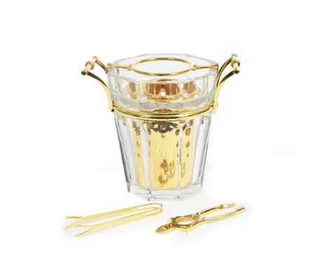 A Baccarat cut glass and gold plated mounted champagne bucketof canted arched panelled flared form, with applied gold plated 