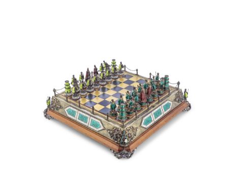 A 20th century Continental white metal, parcel gilt, polychrome guilloche enamel and semi-precious gem set figural chess set 