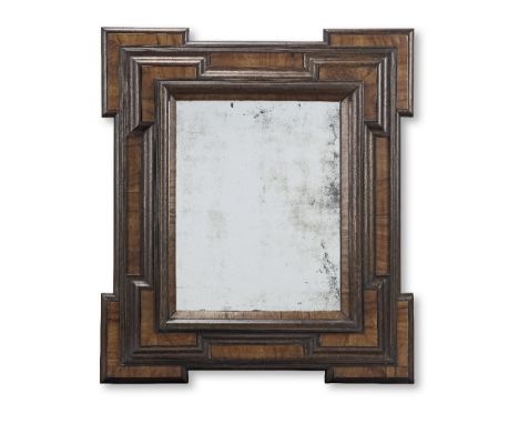 A Dutch late 17th/early 18th century walnut or fruitwood and ebonised mirrorThe later plate within an ovolo moulded frame enc