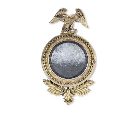 A Regency or early 19th century giltwood and gilt gesso convex mirrorThe later plate within an ebonised reeded slip, encompas