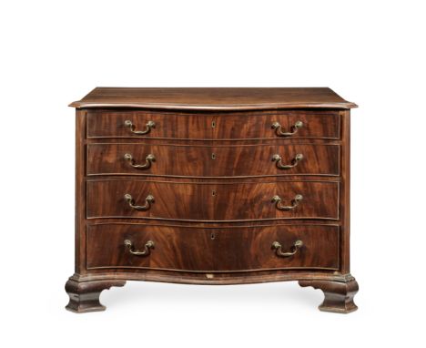 A George III mahogany serpentine commodeThe top with an ogee moulded edge, above four long graduated oak lined drawers, flank