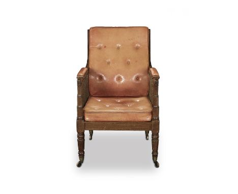 A Regency mahogany caned bergereCirca 1820With channelled frames and arms, with flared ring turned arm terminals, on ring tur