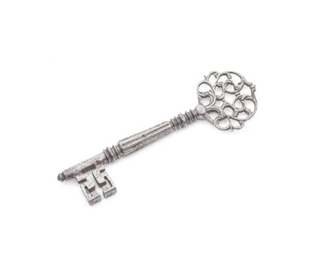 An 18th century steel keyprobably Frenchwith elaborate scroll pierced and engraved bow, the shaft with tapering reeded and ri