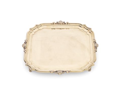 A 9 carat gold salvermaker B.C, Sheffield 1976  Shaped-square form with moulded borders, each side with an applied flower hea
