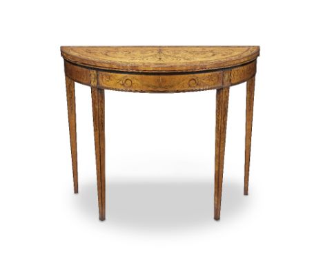 A mid Victorian satinwood, purplewood and fruitwood marquetry demi-lune card table1860-1880, in the George III Neoclassical s